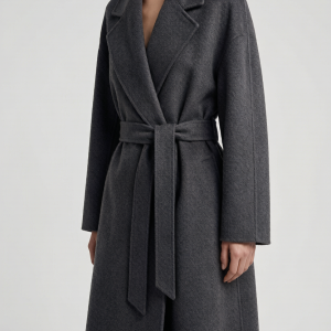 A floor-grazing double-face overcoat in Italian wool-cashmere. The wrap silhouette ties at the waist with a self-belt, a