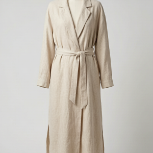 A lightweight ankle-length duster coat in washed Italian linen. The notched collar, removable self-belt, and side slits