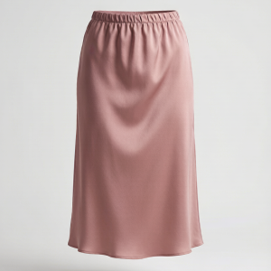 An artfully draped midi skirt in heavyweight satin-back crepe with asymmetric knife pleats. The uneven hemline and fluid